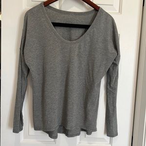 Lululemon long sleeve grey loose fitting too. Size 8. Small stain.